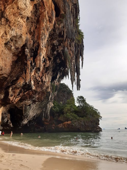 Brown Rock Formation on Body of Water