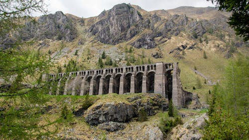 Brown Infrastructure beside a Rocky Mountain 