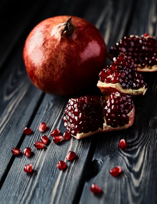 A Pomegranates on a Wooden Table