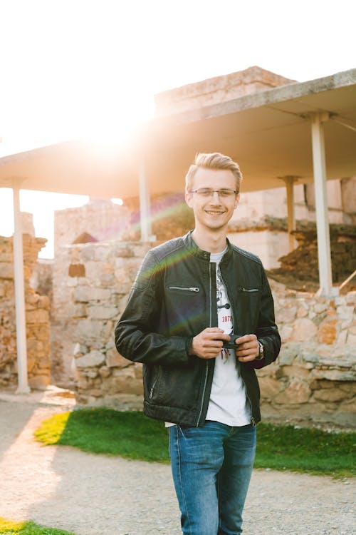 Man in Black Leather Jacket and Blue Denim Jeans 