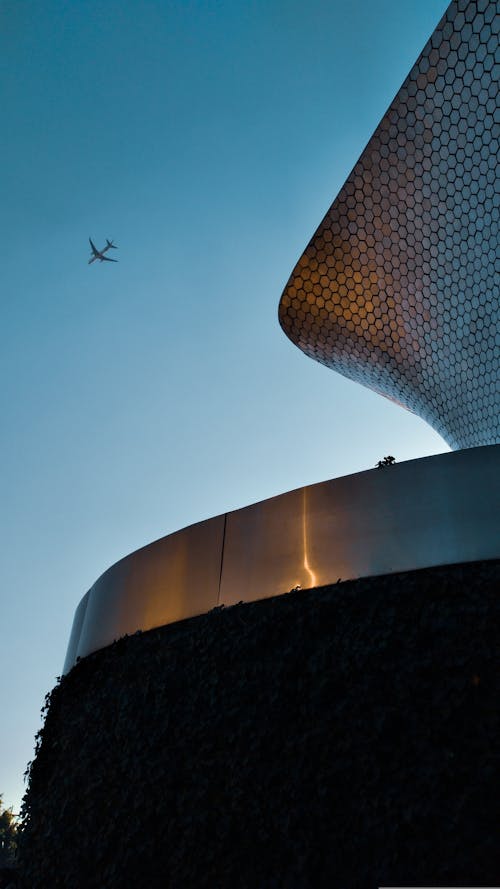 Plane Flying Over Museo Soumaya in Mexico City