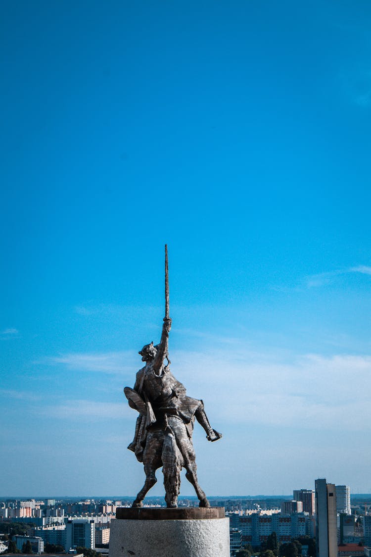 Man Riding A Horse Statue Under Blue Sky