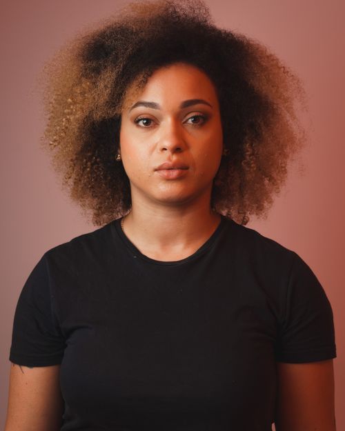 Free Close-up portrait of a woman with an afro hairstyle and neutral expression. Captured in São Paulo. Stock Photo