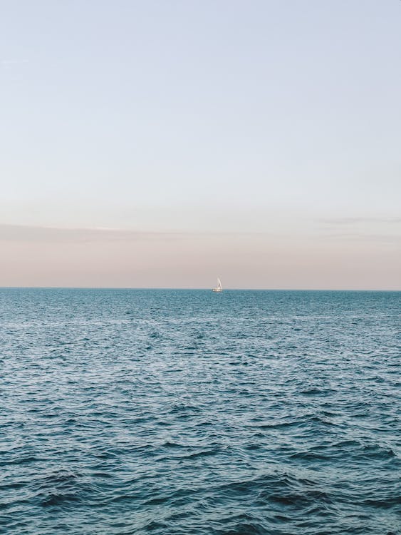 Sailboat on Sea Under a Clear Sky · Free Stock Photo