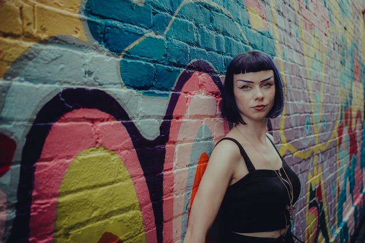 Woman Leaning On A Wall 