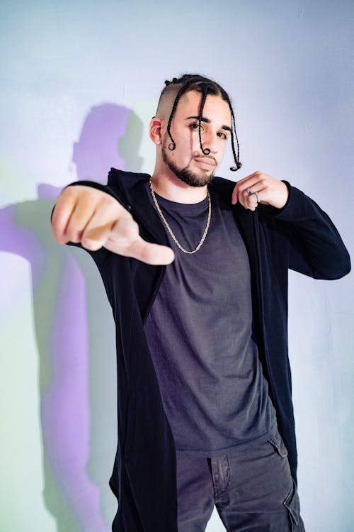 Man in Black Clothing with Silver Necklace