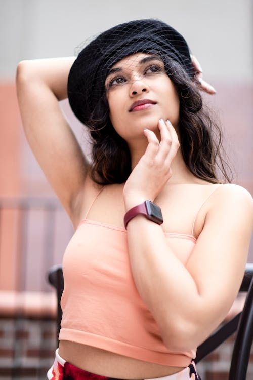 A Woman in Pink Tank Top Looking Up