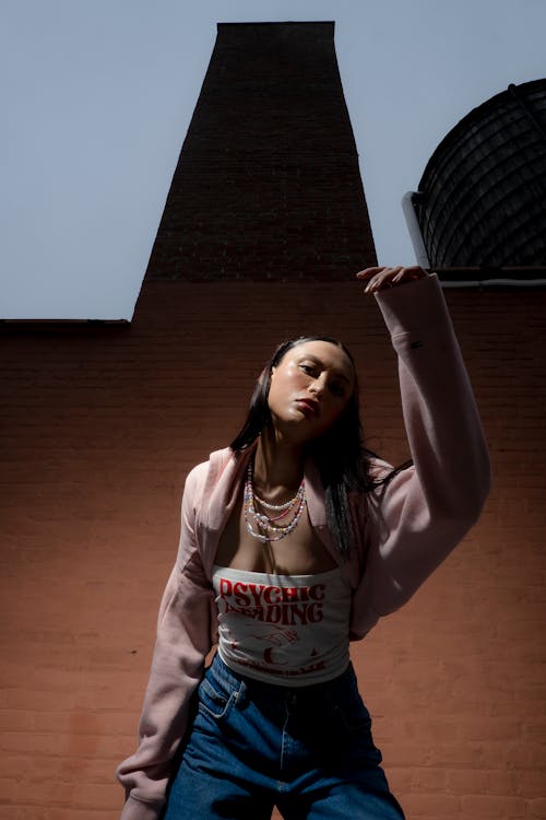 Stylish Woman in Pink Jacket and Denim Jeans