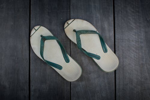 Pair of Green and White Flip Flops