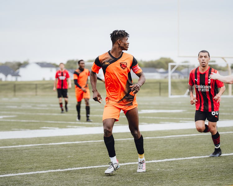 Photo Of Playing Football Players