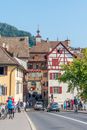 Vintage old town street lanscape with timbered houses town hall at the end in the historical town in Eastern Europe  on a sunny summer day