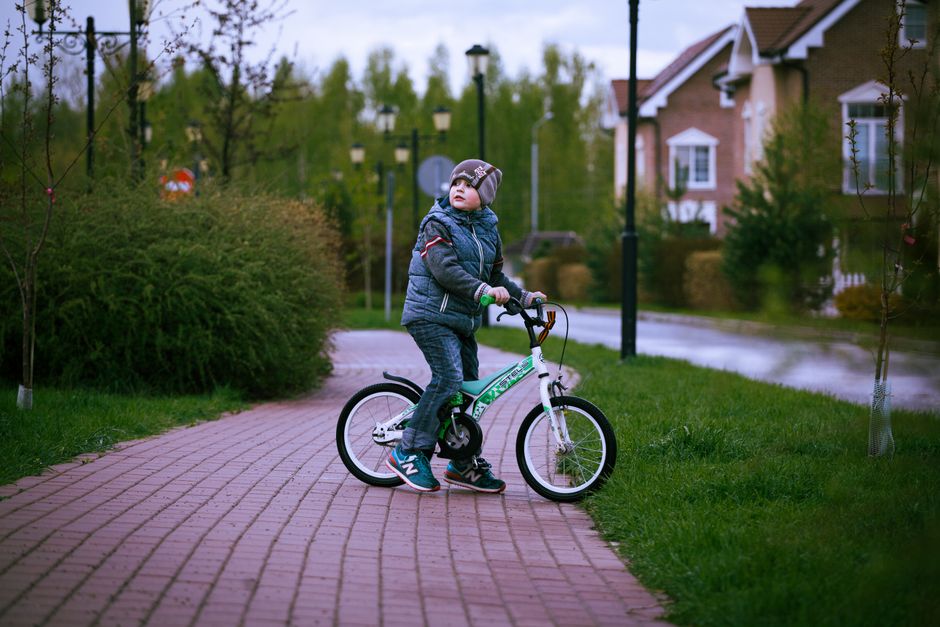 child bicycle suburban driveway