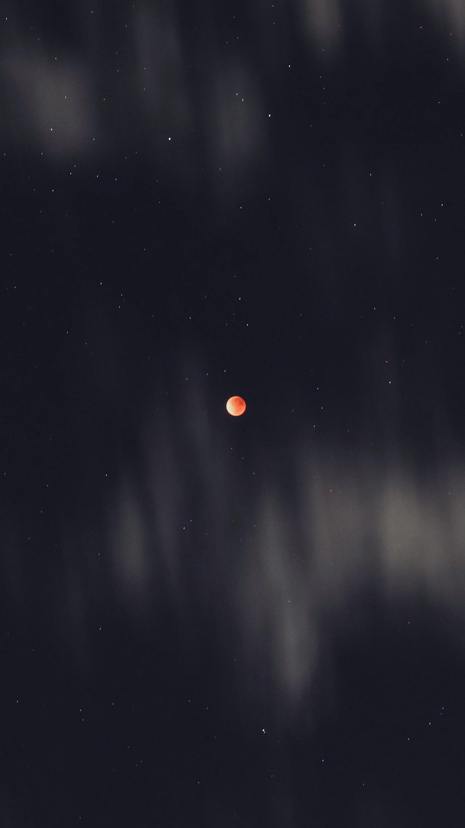 moon eclipse in cloudy black sky