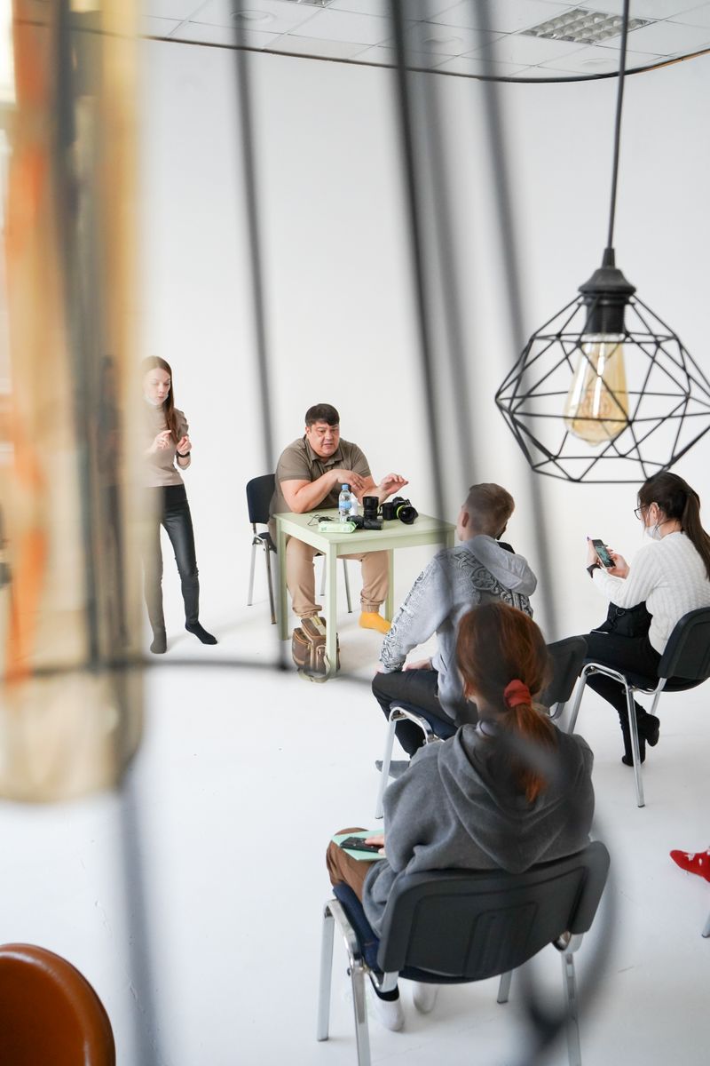 A group discussion in a modern studio setting with a focus on learning and engagement.