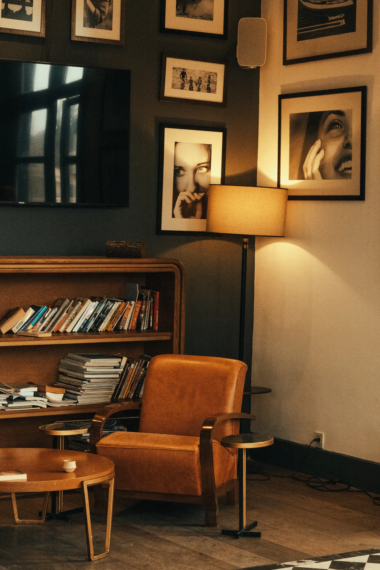 small-living-room-bookshelf-styling Small living room corner with styled bookcase, leather chair and floor lamp