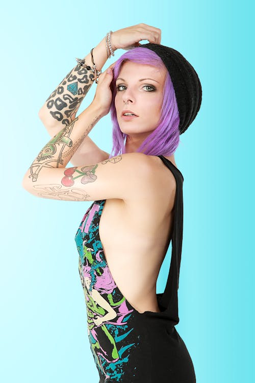 Stylish Woman with Tattooed Arm 