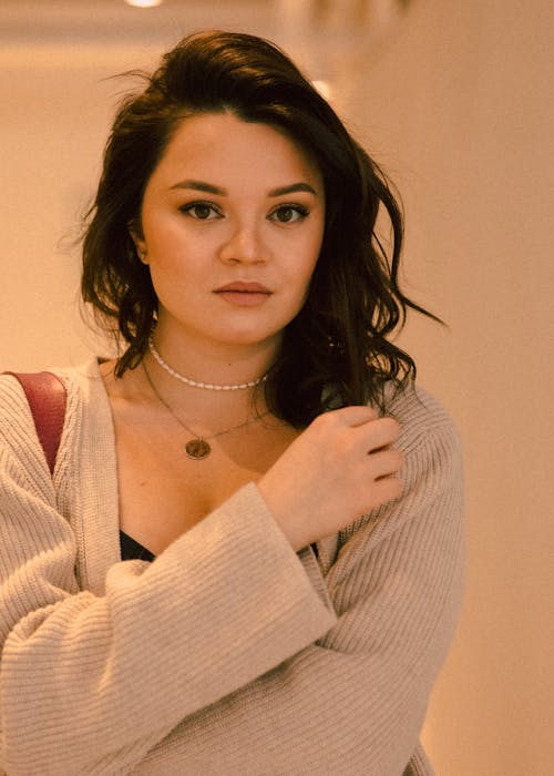 Close-up Photo of Woman in Knitted Cardigan