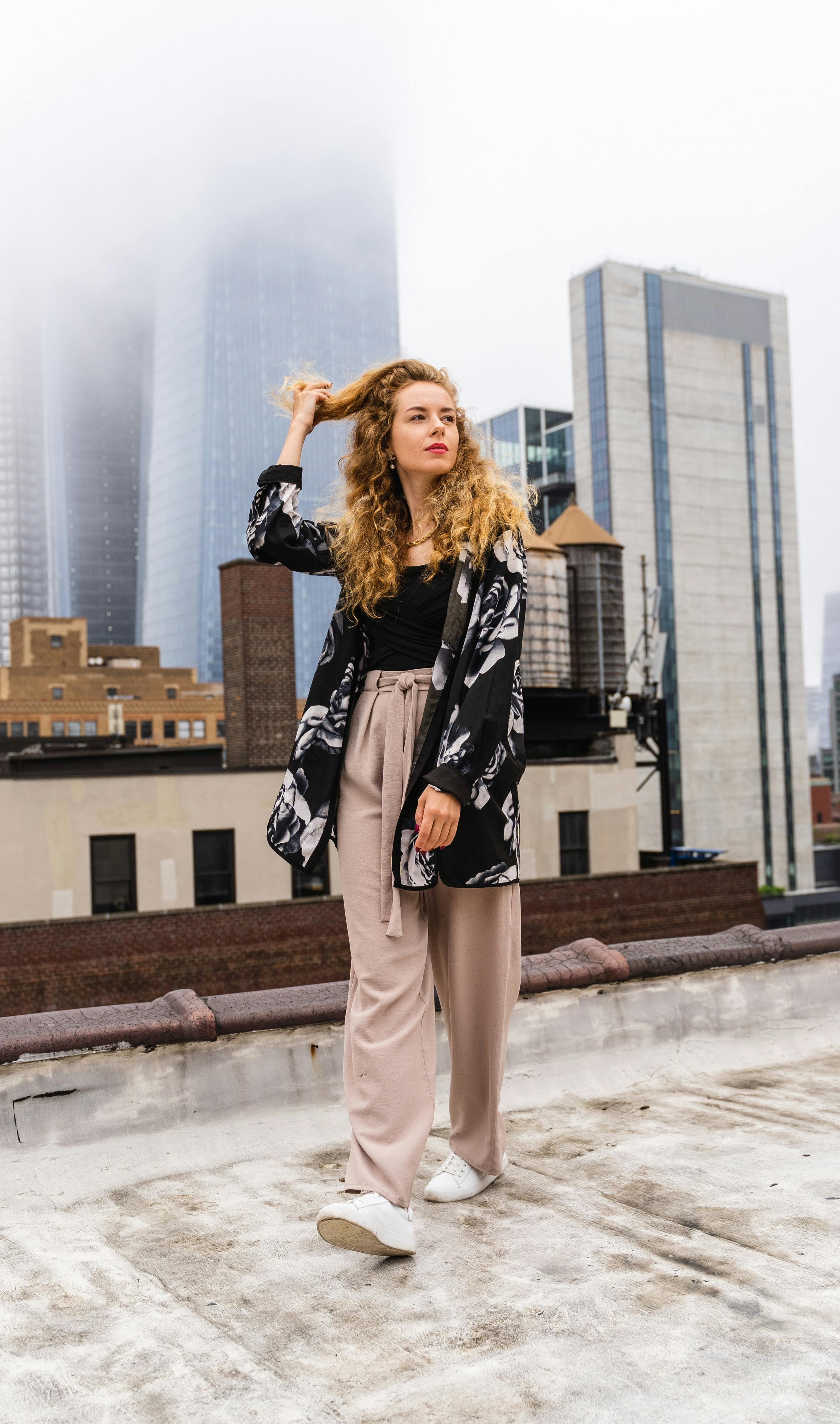 woman fashion model posing on rooftop