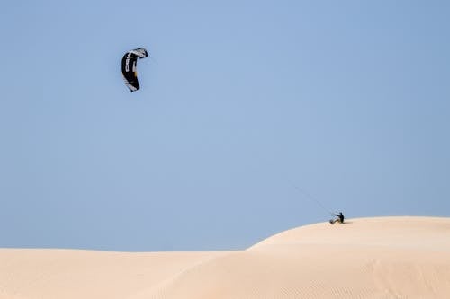 Man with Kite on Desert
