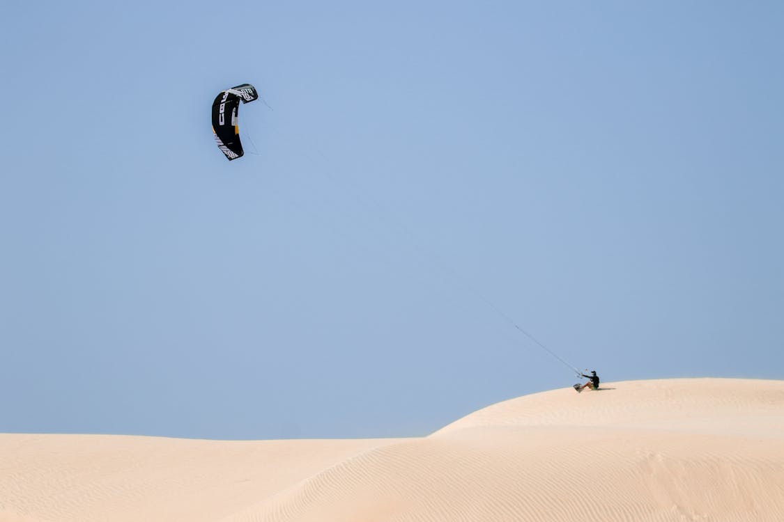 Man with Kite on Desert