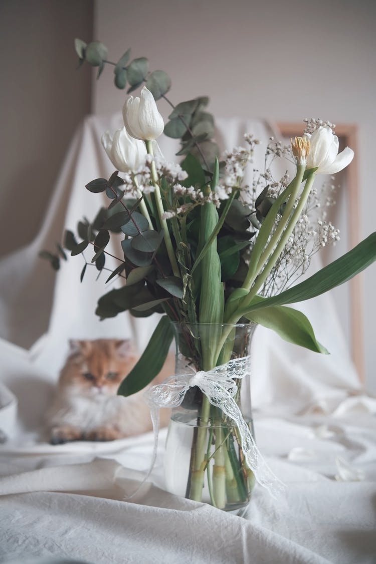 White Flowers On Clear Glass Vase