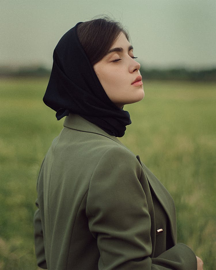 Portrait Of Woman With Headscarf And Green Jacket