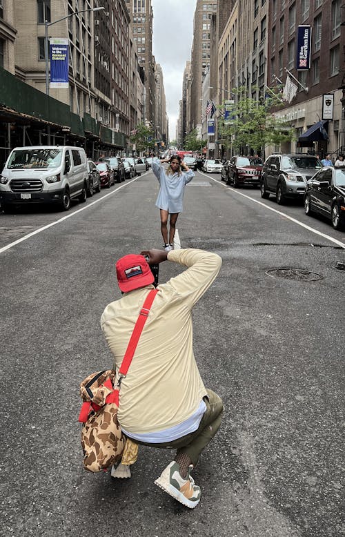 Photographer Taking Picture of a Woman on the Street