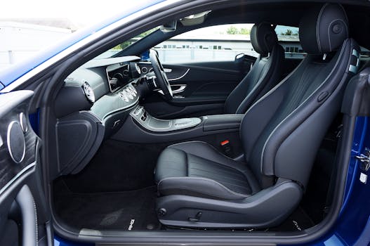 Elegantly designed modern car interior featuring luxurious leather seats and a sleek dashboard.