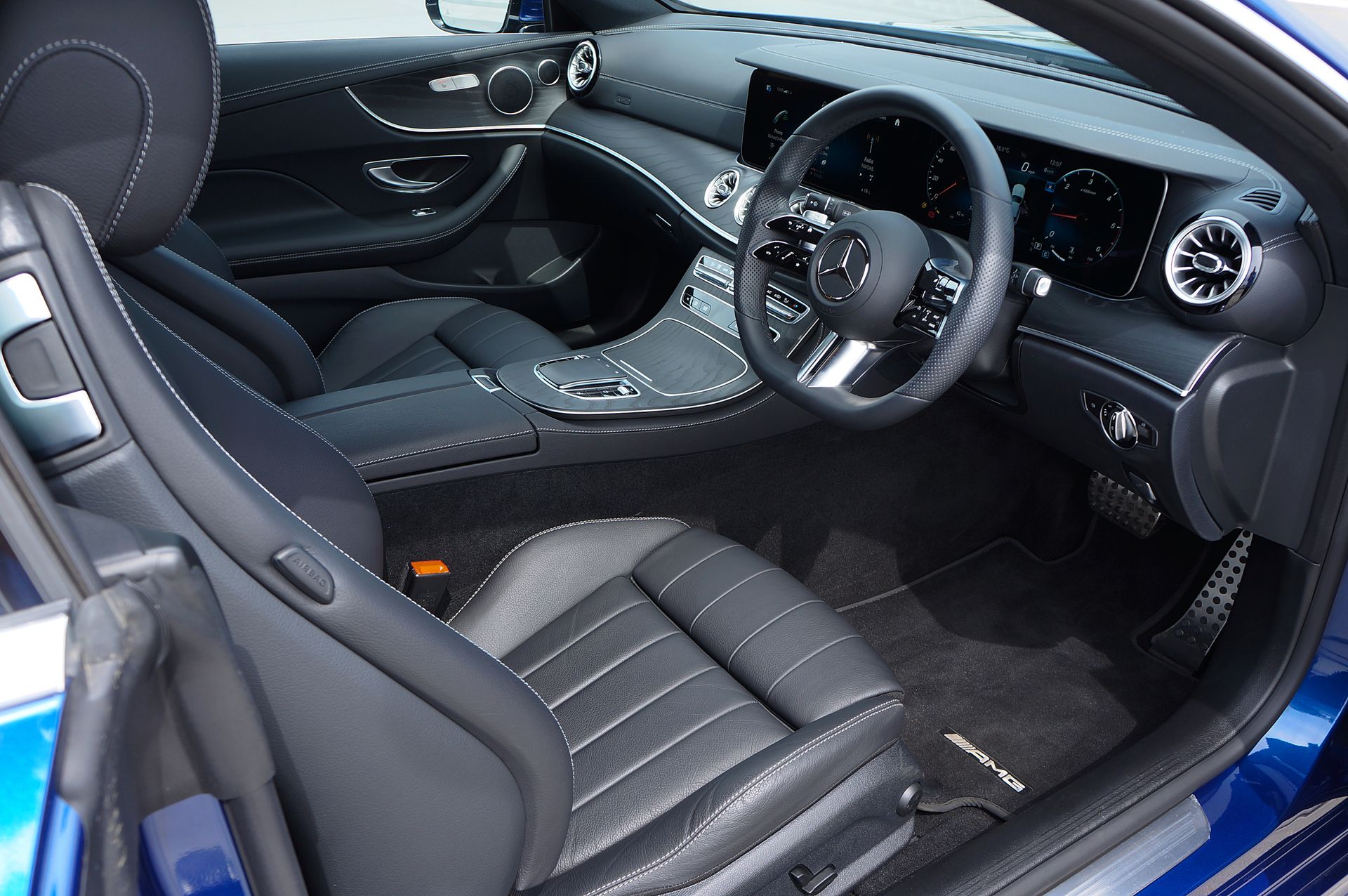 Sleek and modern luxury car interior featuring leather seats, a premium dashboard, and advanced features.