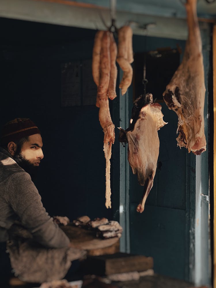 A Vendor Selling Meat In The Market