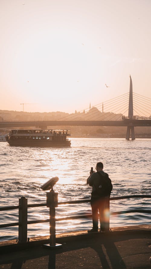 Man Taking a Picture on the Coast in Istanbul 