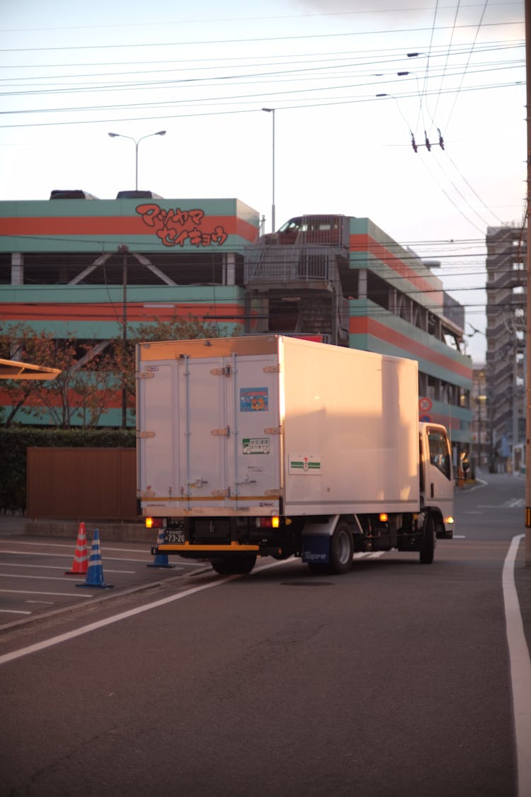 White Truck Travelling The Road