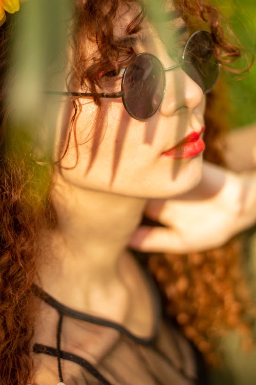 A Woman Wearing a Round Sunglasses