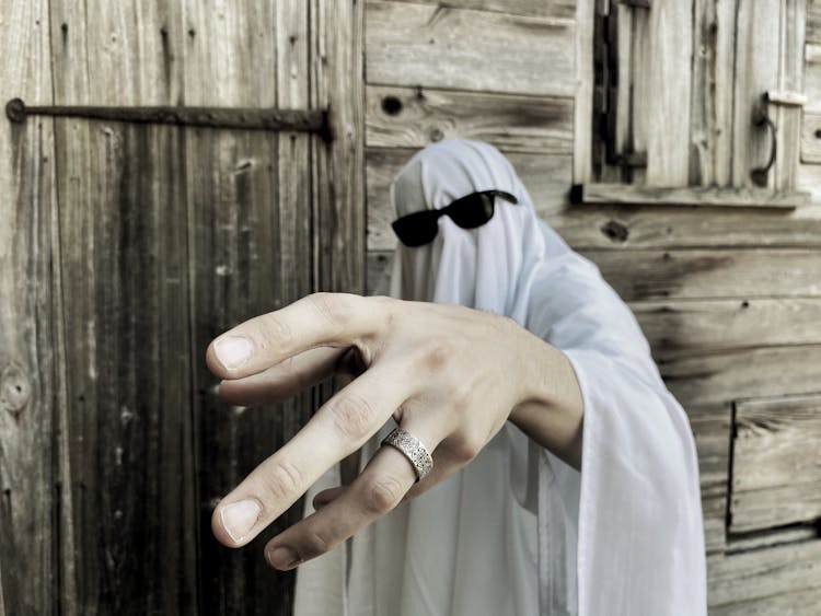 Abstract Photo Of Man Wearing Sheet And Sunglasses