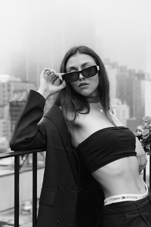 Sexy Woman Posing in Suit and Sunglasses
