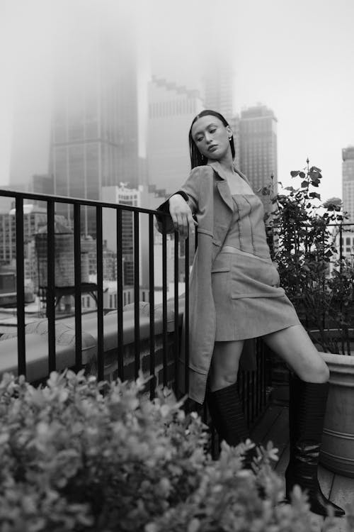 Stylish Woman Model Posing on a Balcony