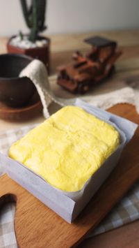 Slab of fresh butter on a wooden board — photo by Lupa Byds on Pexels