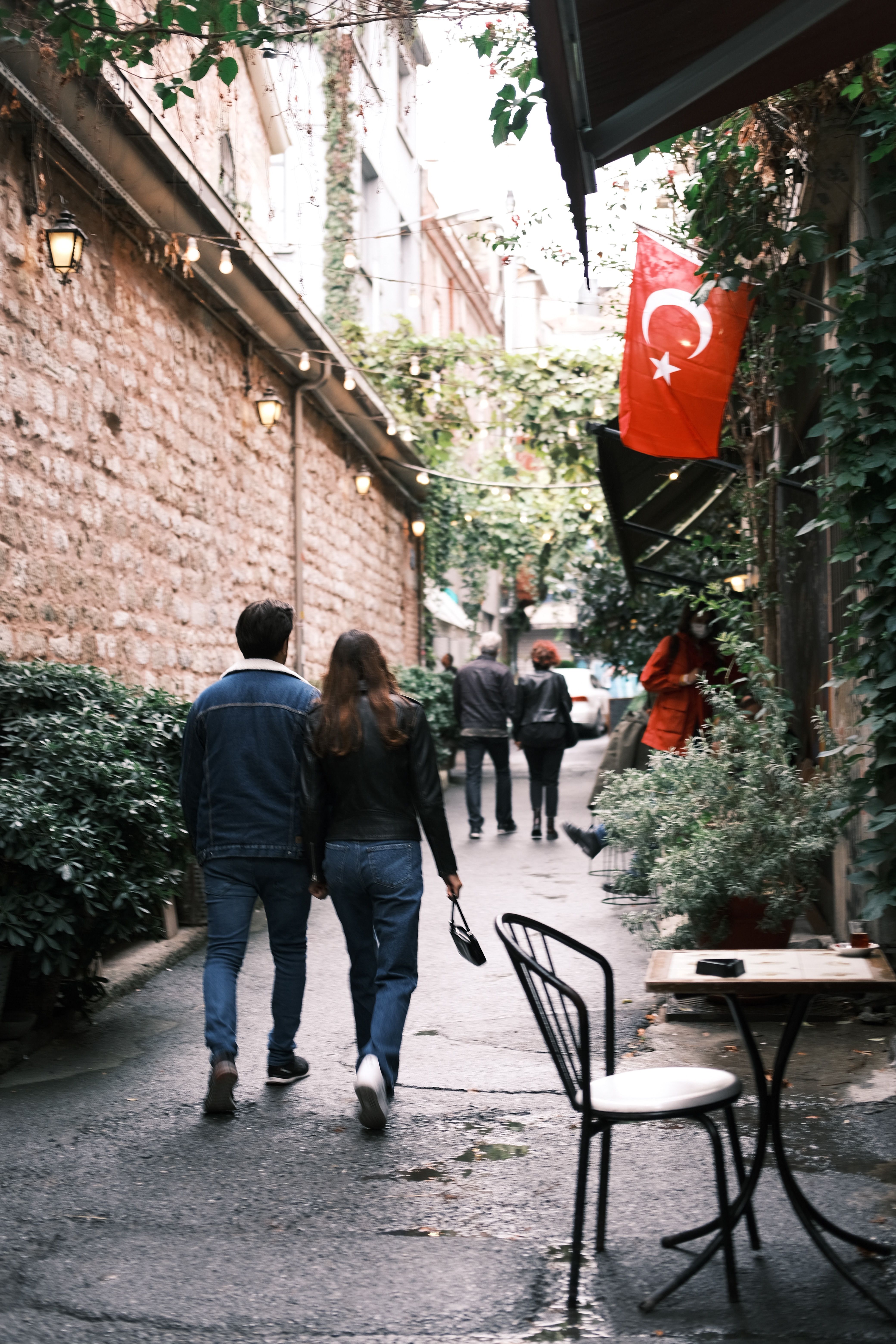 A Back View of Couples Walking on the Street · Free Stock Photo