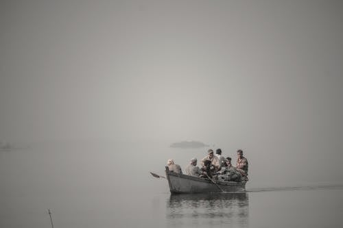 Free Group of Man on a Boat  Stock Photo