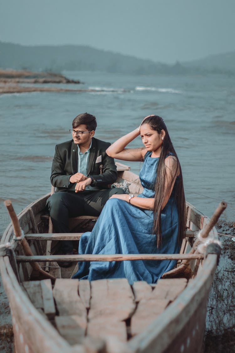 Couple Sitting In A Rowboat