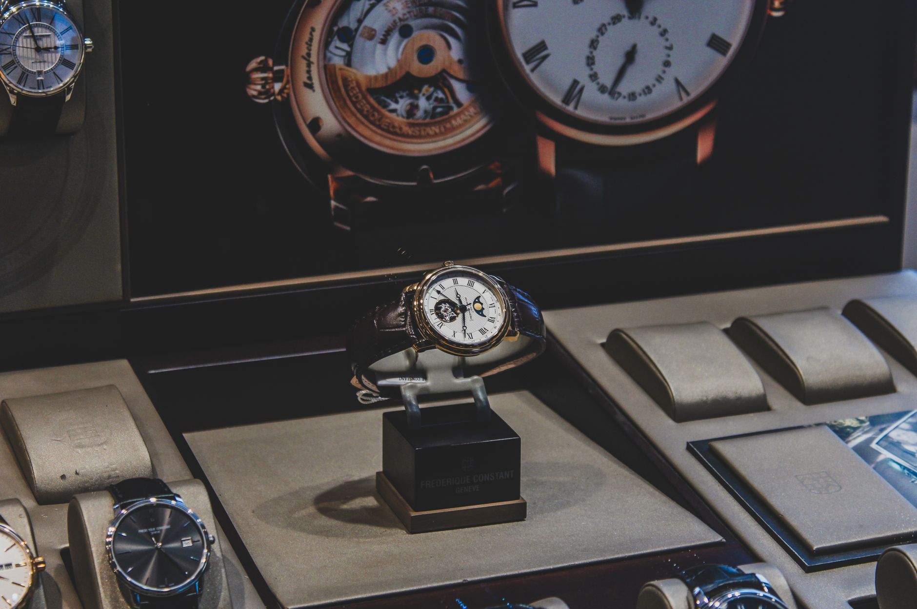 Elegant luxury wristwatches displayed in a sophisticated store with a focus on craftsmanship.