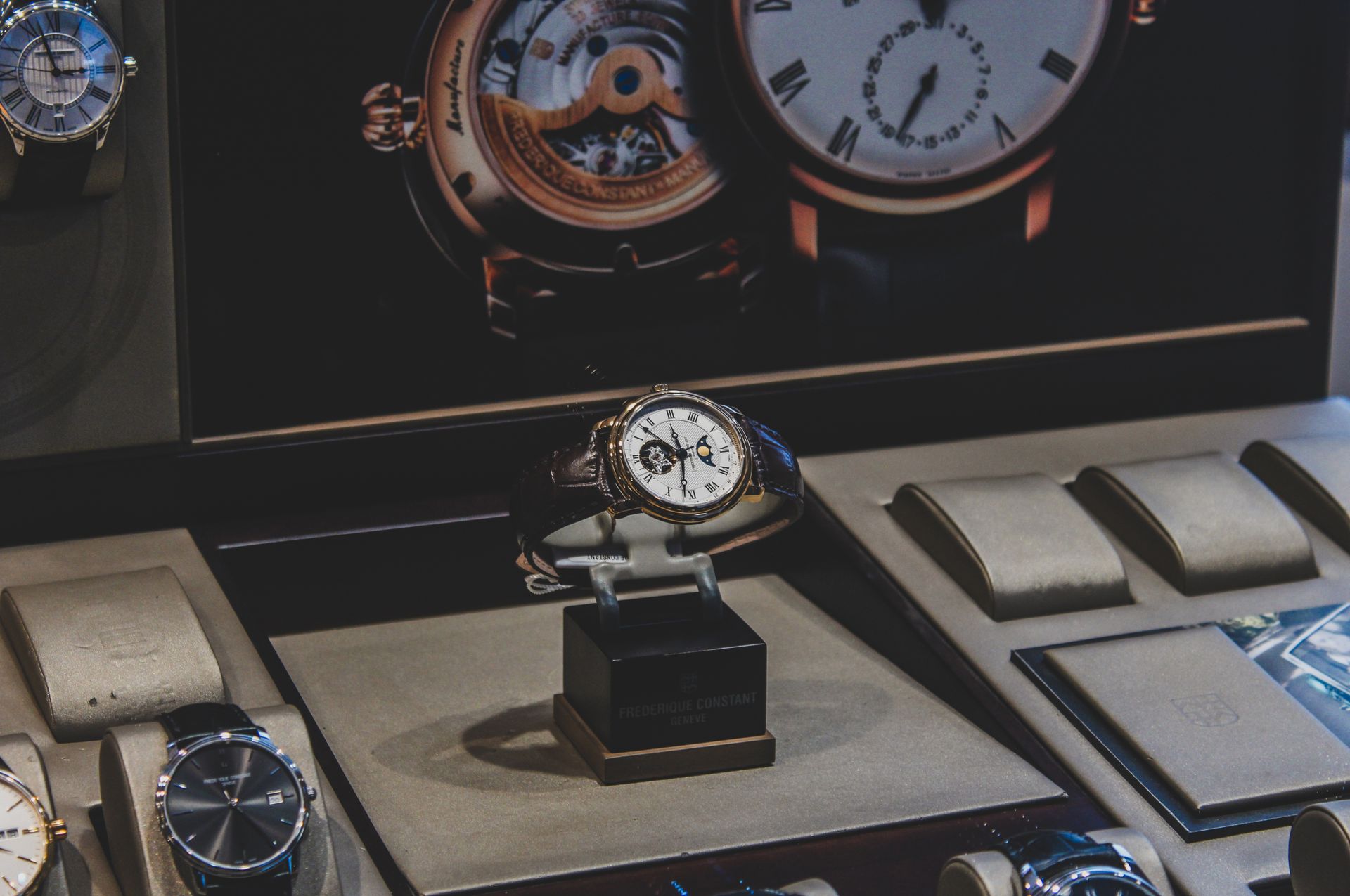 Elegant luxury wristwatches displayed in a sophisticated store with a focus on craftsmanship.