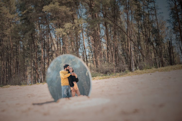 Shot Of Couple Reflection In A Mirror