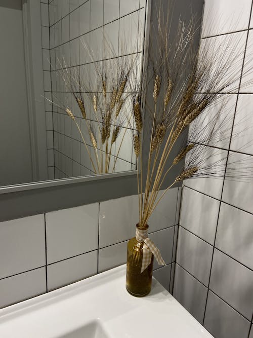 Dried Wheat Grass on Glass Bottle