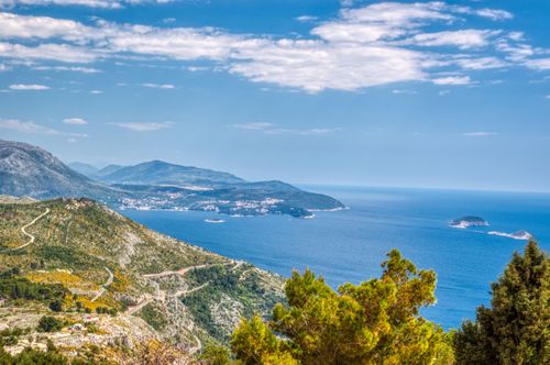Free Scenic aerial view of the Dubrovnik coastline and Adriatic Sea on a sunny day. Stock Photo