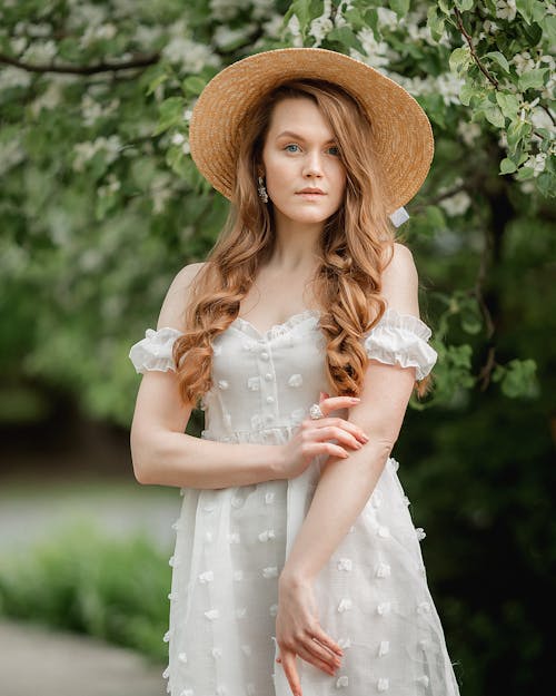 Woman in Dress and Hat