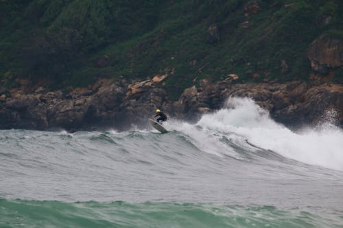 Man Surfing on Ocean Waves