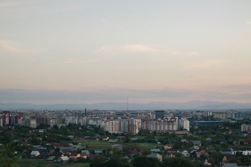 Free Aerial view of a cityscape at twilight showcasing an urban skyline with buildings and clear sky. Stock Photo