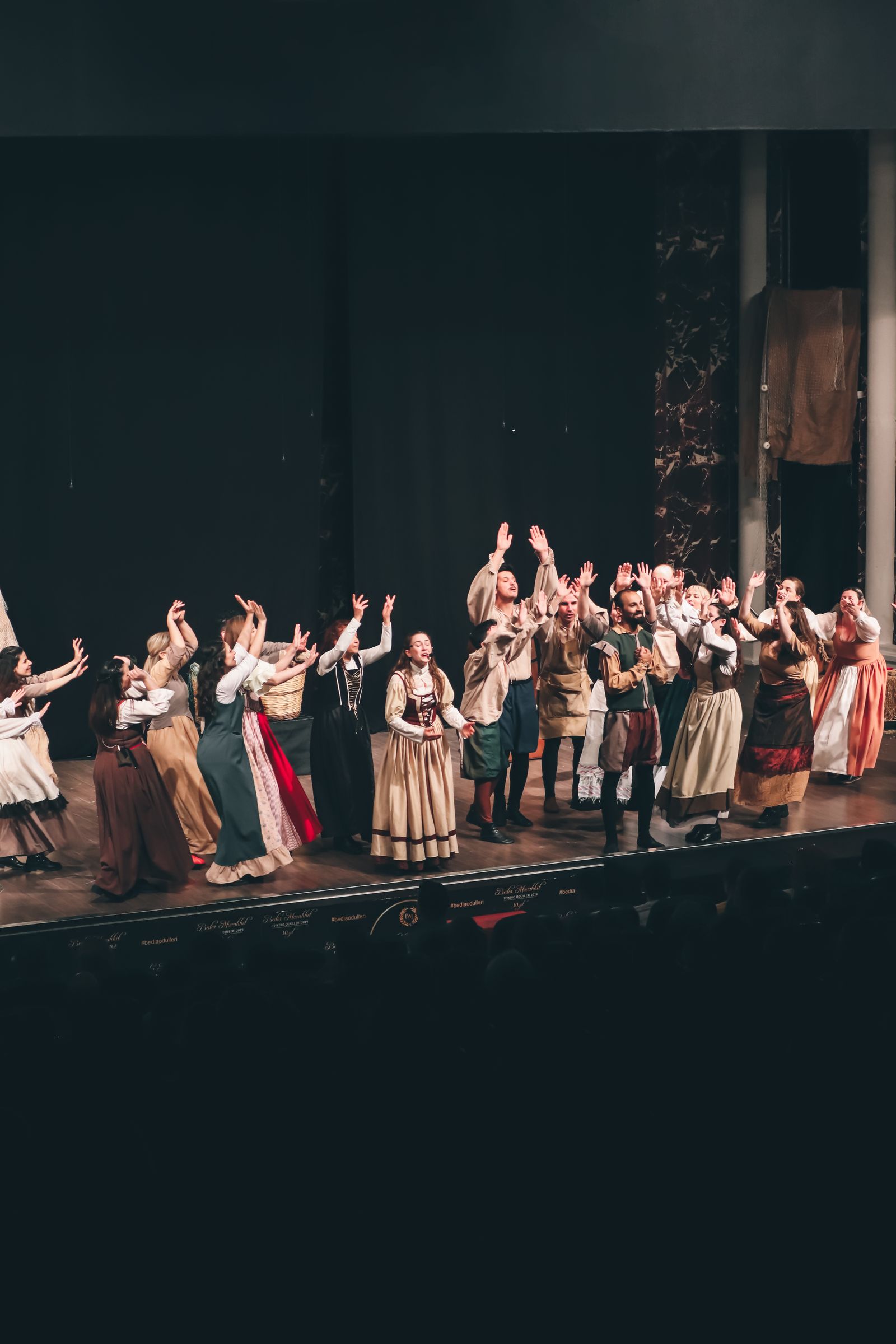 Performers mid scene on stage
