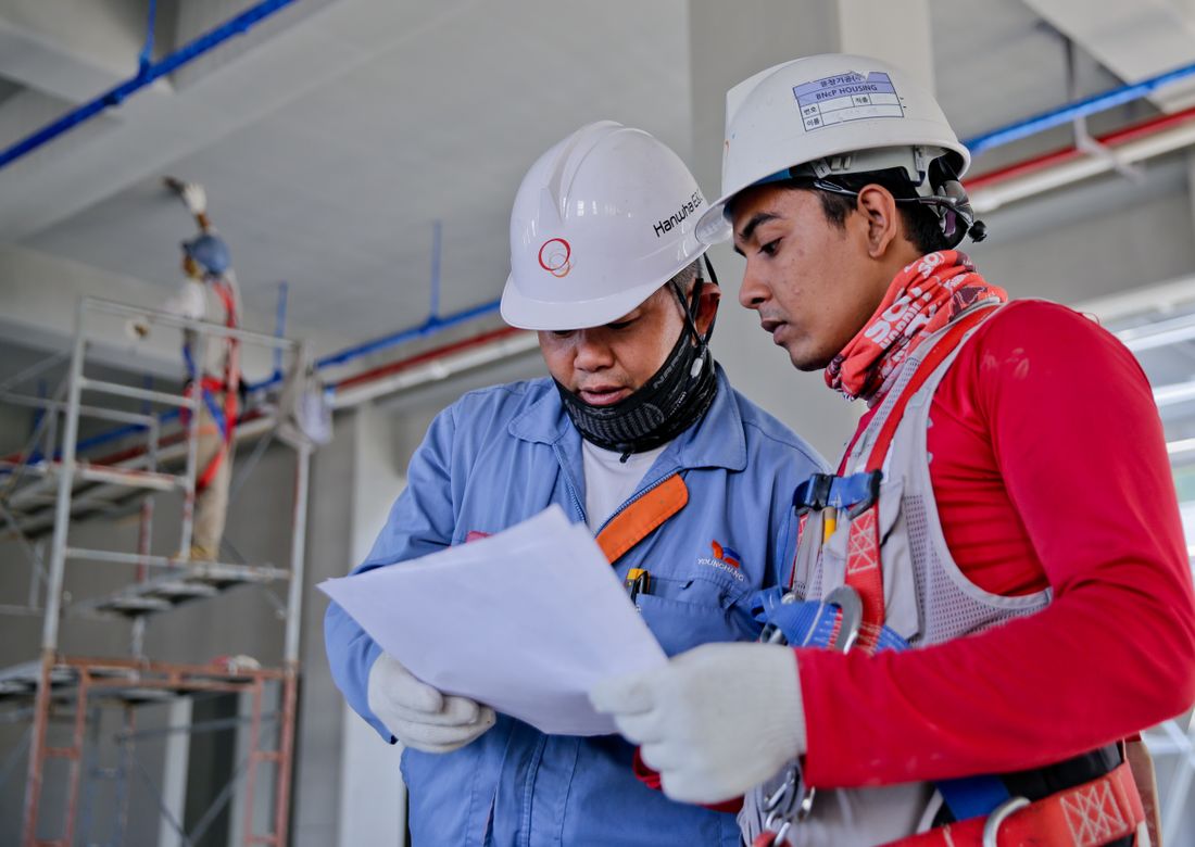 Construction crew discussing project execution